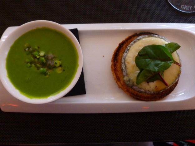 Green pea soup cold with cream and goat cheese on toast