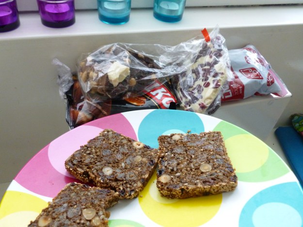 Nut and fruit chocolate bark, salty licorice (drope) and bread