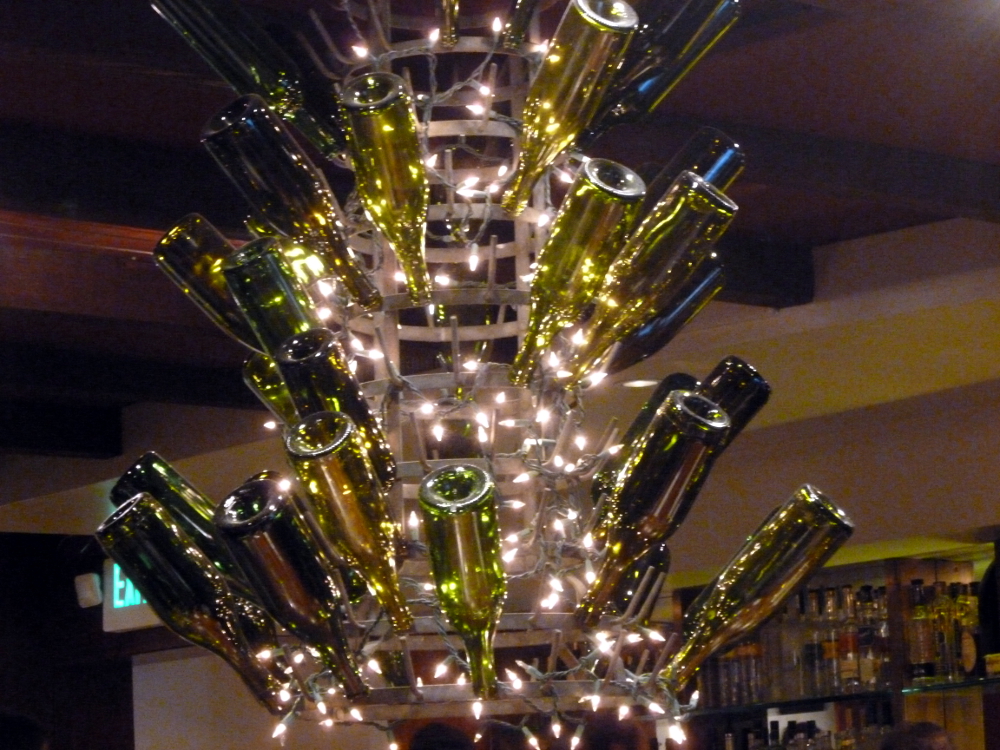 A beautiful chandelier made with wine bottles.