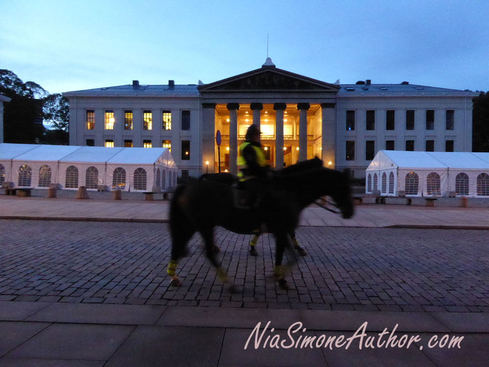 Equestrian police in front of something, not sure