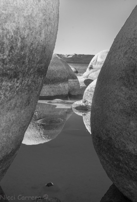 A black and white image of boulders in Lake Tahoe, Sand Harblr